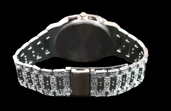 Regal Nocturne Timepiece
Elevate your style with the Regal Nocturne Timepiece – a masterfully engraved luxury watch that blends timeless elegance with bold craftsmanship. Featuring a textured dial, moonphase subdial, and intricate metalwork, this statement piece is designed for those who appreciate sophistication in every second. - Silver