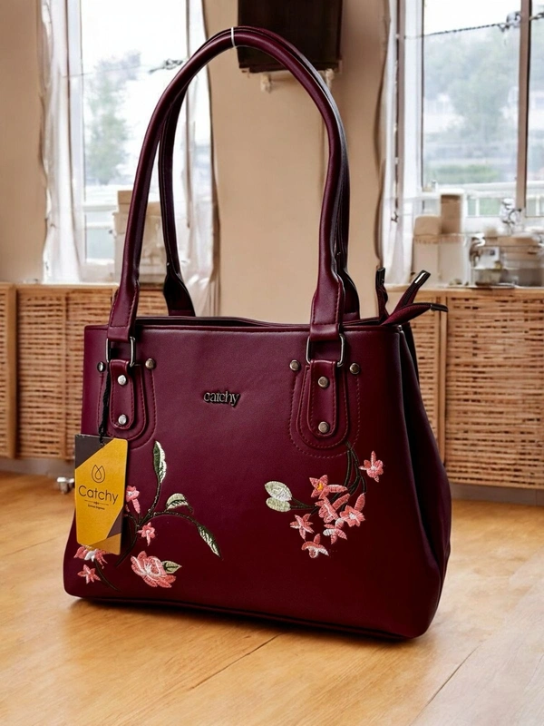 Catchy Maroon Handbag with Floral Embroidery