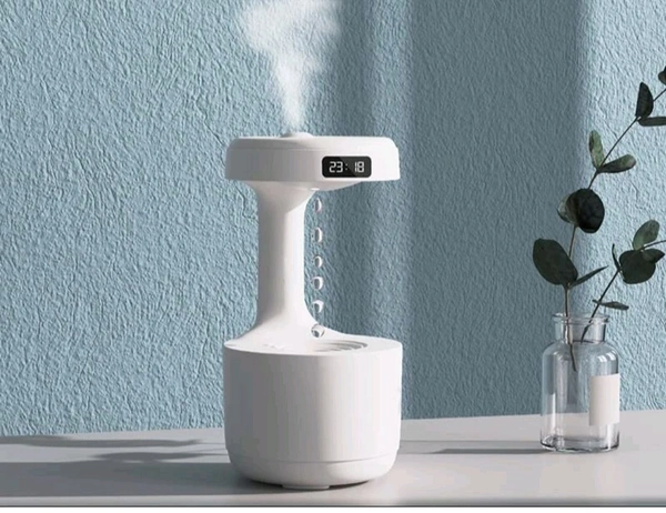 Anti-Gravity Water Flow with Smart LED Clock Display: The anti-gravity water flow technology creates the illusion of backflow droplets and a soothing running water noise with a smart LED Clock display to track time and a warm light.

Air humidifier: Water drop reflux atomization technology - White, 1
