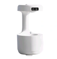 Anti-Gravity Water Flow with Smart LED Clock Display: The anti-gravity water flow technology creates the illusion of backflow droplets and a soothing running water noise with a smart LED Clock display to track time and a warm light.

Air humidifier: Water drop reflux atomization technology - White, 1