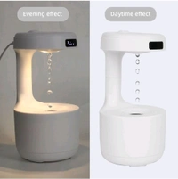 Anti-Gravity Water Flow with Smart LED Clock Display: The anti-gravity water flow technology creates the illusion of backflow droplets and a soothing running water noise with a smart LED Clock display to track time and a warm light.

Air humidifier: Water drop reflux atomization technology - White, 1