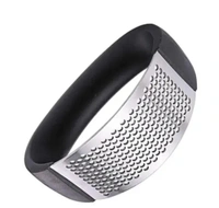 Garlic Press Rocker, Stainless Steel Garlic Mincer Crusher Professional Kitchen Gadgets Garlic Chopper with Ergonomic Handle, Silicone Garlic Peeler 1Pcs 
 - Black