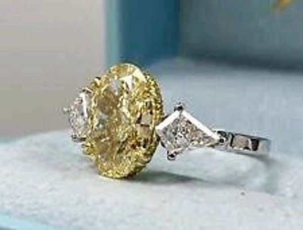 Yellow LGD Diamond, 5 cts, Oval Shape, and on both Side Kite Shape LGD Diamonds,   Designer Limited Edition Ring