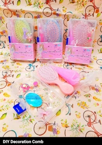 Comes in a plastic box with comb, decorative material and glue