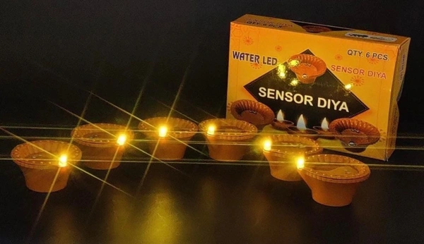 *water sensor diya  How to Use: Pour water into the diya and the diya will light up.  Double mould diya with long life comes with coin cell.🌟🌟  🌟🌟  Box of 6 pieces with cells inside. 💕💕
