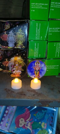 Led candles with detachable acrylic rings with god image Buy box of 12 pcs of mix designs. Most boxes have 11 ganesha n 1 lakshmi ji pcs Real pic shared