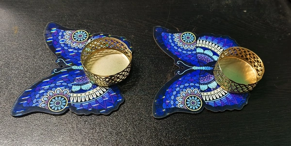Mdf tealight holder in mandala and evil eye and butterfly.Buy any design 2 pcs. Wax tealight included Size 4 inches