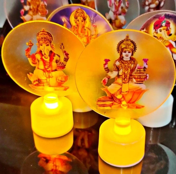 Led candles with detachable acrylic rings with god image Buy box of 12 pcs of mix designs. Most boxes have 11 ganesha n 1 lakshmi ji pcs Real pic shared