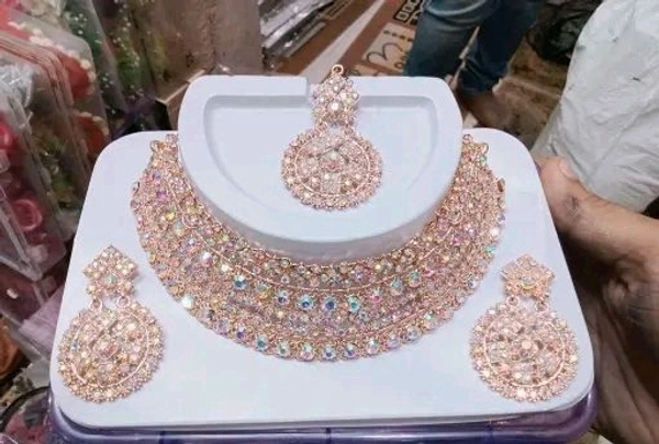 Rose gold necklace set with earrings 
Name: Rose gold necklace set with earrings 
Base Metal: Alloy
